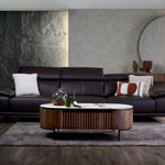 Kof leather sofa front view with a refined profile
