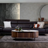 Kof leather sofa front view with a refined profile