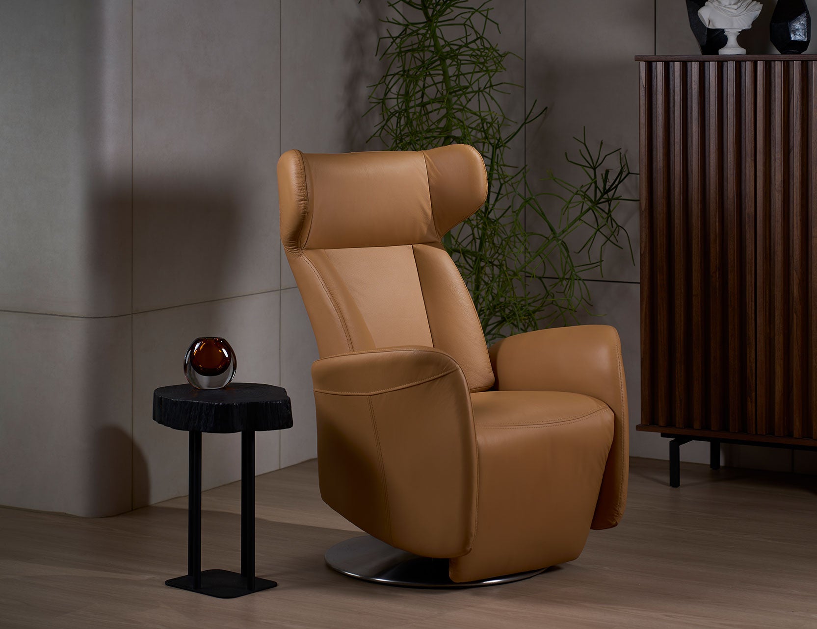Wingback chair paired with stem table and storage rack