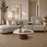 Cellini cream leather sectional sofa with curved ottoman and power recliner in a warm minimalist living room
