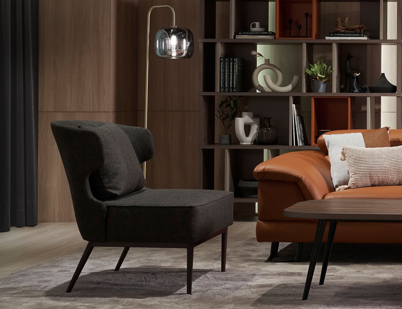 Wing fabric armchair shown from a side angle