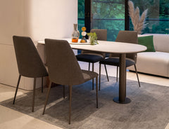 Capsule dining table paired with Henry chairs
